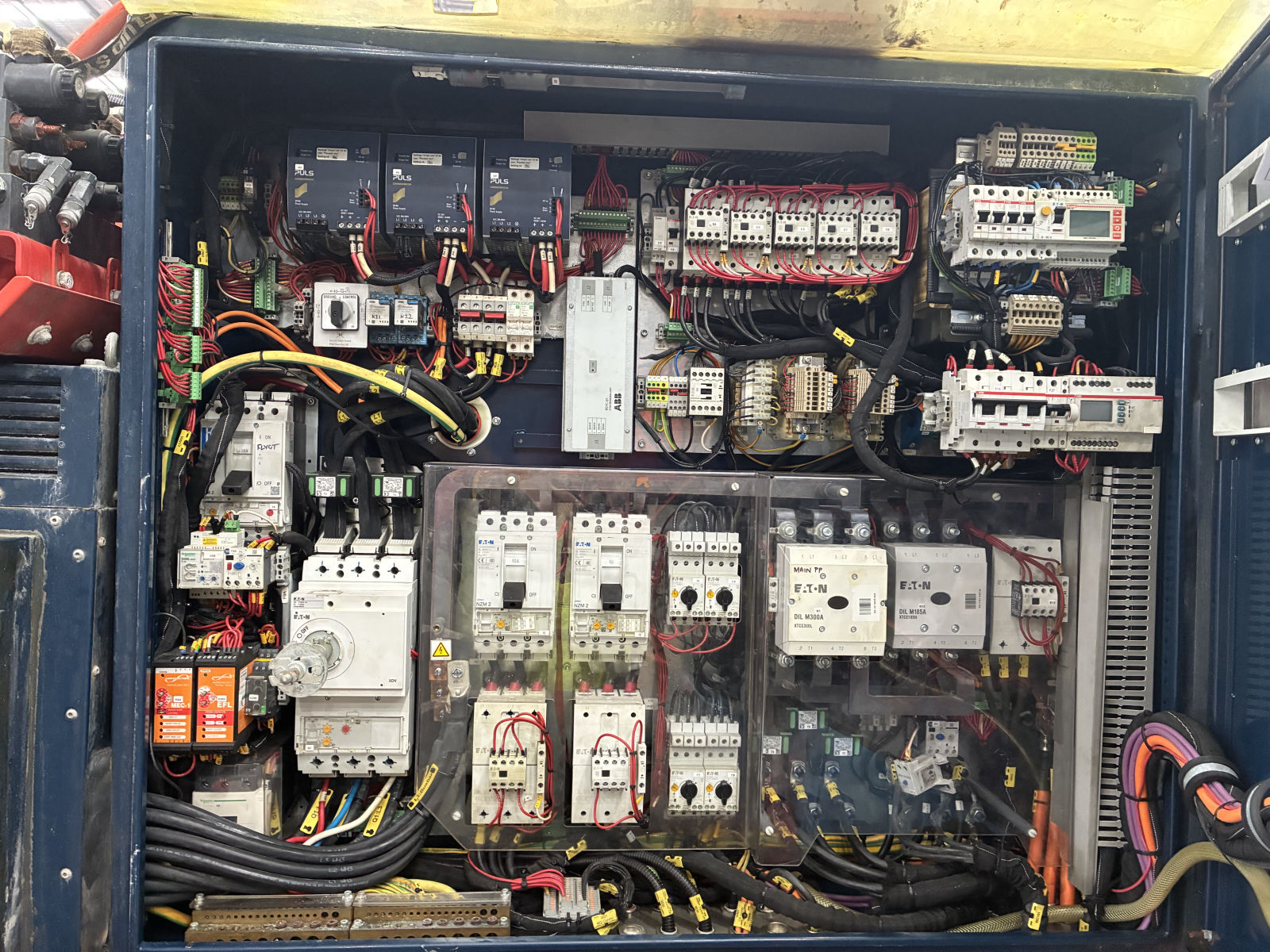 Drill rig electrical panel showing contactors, protection devices and numbered control wiring