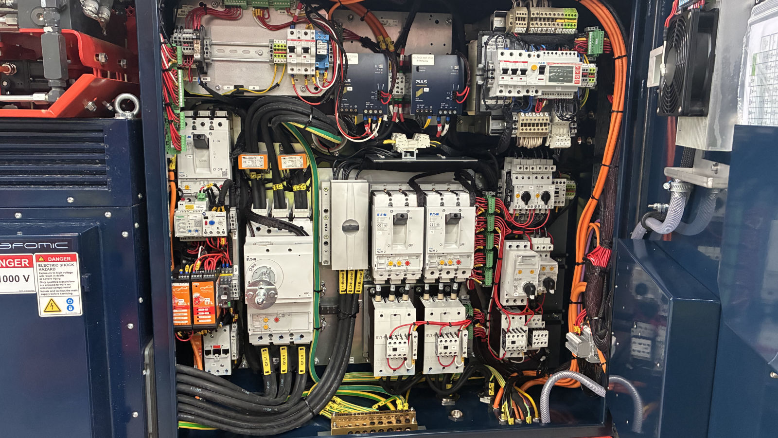 Underground drill rig control panel with protection devices, contactors and labelled power and control wiring
